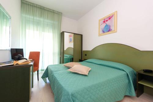 Postel nebo postele na pokoji v ubytování Hotel Sirena