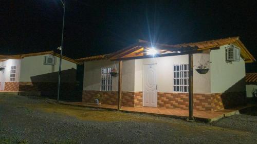 a small house with a light on it at night at Altamira Biohotel in Socorro