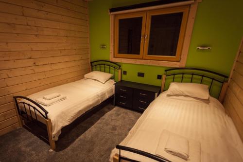 Postel nebo postele na pokoji v ubytování iLodge Ultra