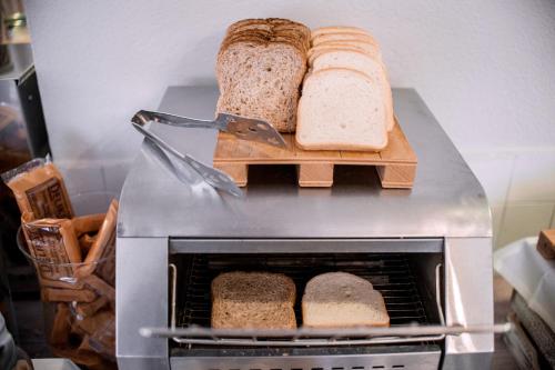 two slices of bread sitting on top of an oven at Hotel Bacco Rooms and Breakfast in Pietra Ligure