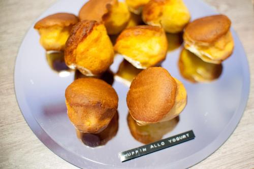 a white plate with some food on it at Hotel Bacco Rooms and Breakfast in Pietra Ligure