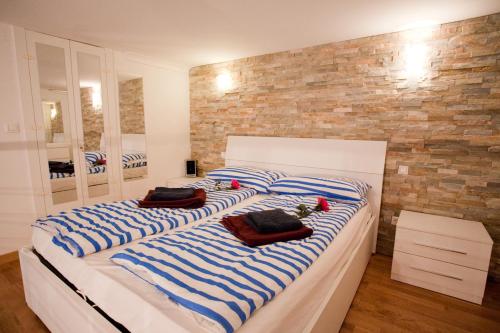 a bedroom with two beds with towels on them at 10 House in Budapest
