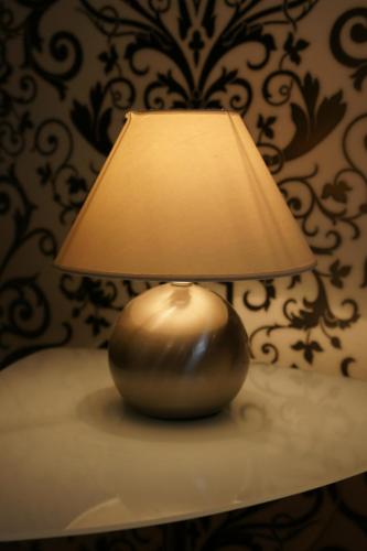 a lamp sitting on a table next to a wall at Hotel Stern in Düsseldorf