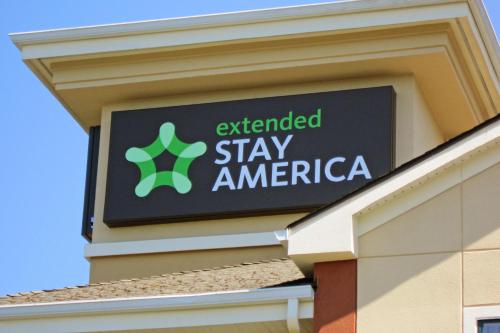 an extended stay america sign on the side of a building at Extended Stay America Suites - Columbia - Columbia Parkway in Columbia