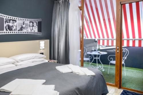 a bedroom with a bed and a view of a table at B&B Sorrento Queen in Sorrento