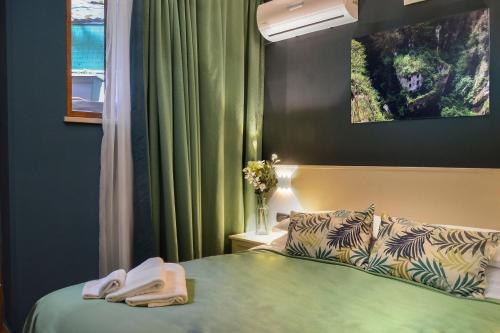 a hotel room with a bed and a window at B&B Sorrento Queen in Sorrento