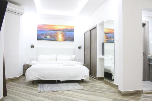 a bedroom with two beds and a large mirror at SUNSET HOTEL in Nouakchott