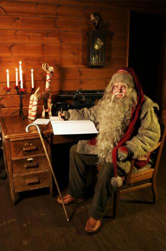 a man dressed as santa claus sitting at a desk at Spa Hotel Rauhalahti in Kuopio