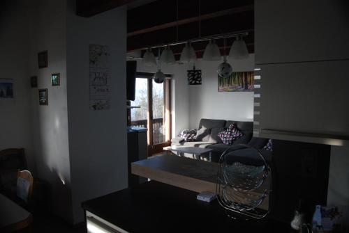 a living room with a couch and a window at Weinberg-Panoramaferienhaus in Kitzeck im Sausal