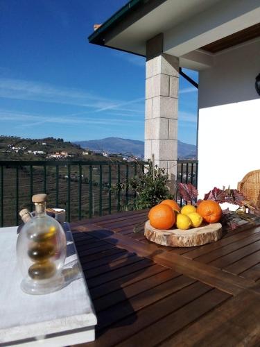 a bunch of fruit sitting on a wooden deck at Quinta de Penelas in Lamego