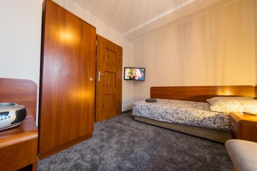 Ein Bett oder Betten in einem Zimmer der Unterkunft Willa Maria i Natasza