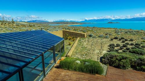 a view of a building with a view of the water at Design Suites Calafate in El Calafate