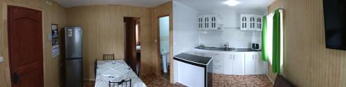 a kitchen with a sink and a counter top at Cabaña entre rios in Villarrica
