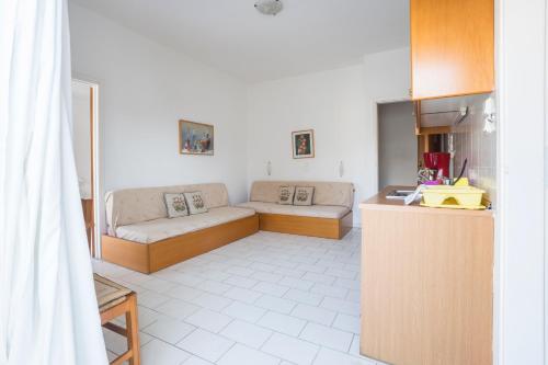 a living room with a couch and a table at Stratis Apartments in Chania Town