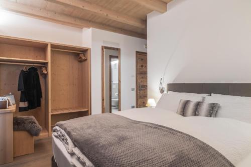 Ένα ή περισσότερα κρεβάτια σε δωμάτιο στο Agriturismo Sicher