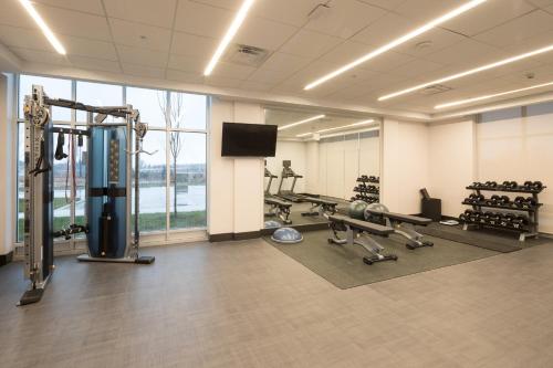 a gym with cardio equipment and a large window at Holiday Inn - Kalamazoo West by IHG in Kalamazoo