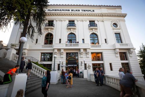 a group of people standing outside of a building at McMenamins Elks Temple in Tacoma