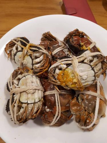a plate of donuts on a white plate at Taitung Crabs House in Chenggong