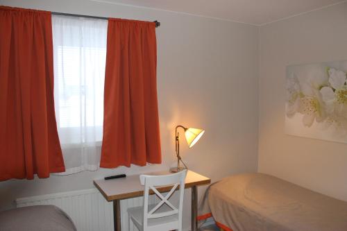 Motelli Jätkänkolo tesisinde bir odada yatak veya yataklar