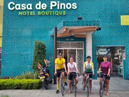 a group of people riding bikes in front of a hotel boutique at Casa de Pinos Hotel Boutique in Bucaramanga