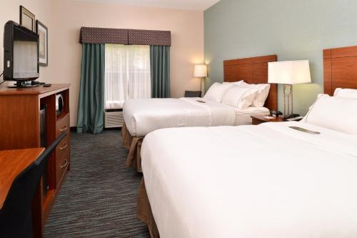 a hotel room with two beds and a flat screen tv at Holiday Inn Express & Suites St Marys by IHG in Grandview
