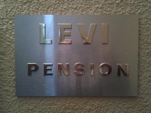 a sign for the new pentagon on a wall at Pension Levi in Berlin