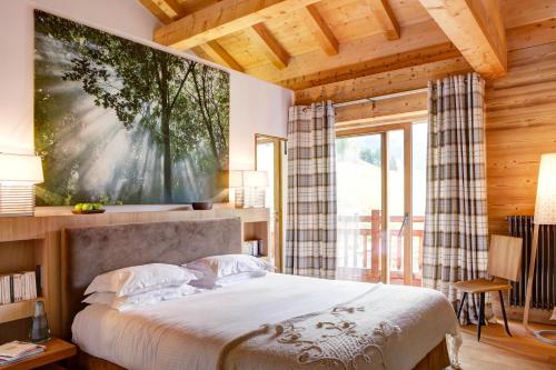 Postel nebo postele na pokoji v ubytování Chalet La Vigogne et Spa