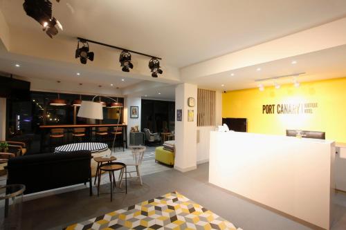 a living room with a couch and a table at Port Canary Airport Hotel in Lat Krabang