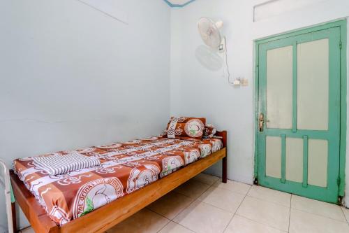 Postel nebo postele na pokoji v ubytování Bahagia Sederhana Homestay