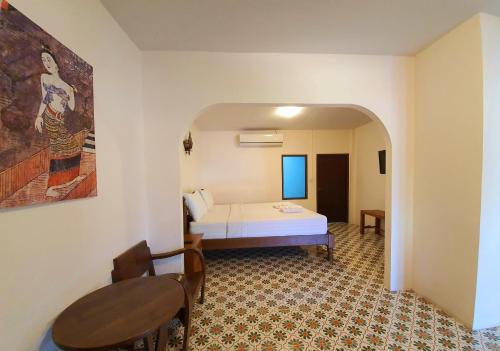 Posteľ alebo postele v izbe v ubytovaní Nan Lanna Hotel