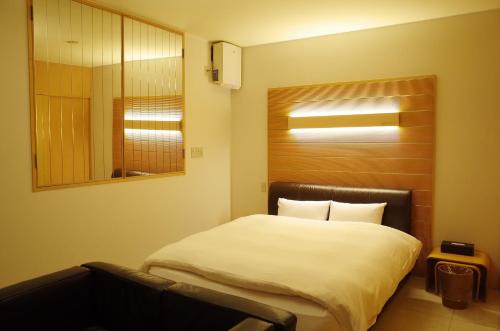 Hotel JOYCEにあるベッド