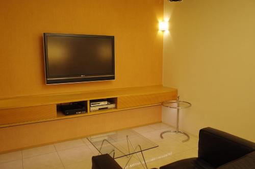 Hotel JOYCEにあるテレビまたはエンターテインメントセンター