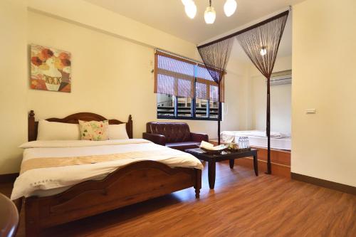 Cama o camas de una habitación en 橫賓浪漫民宿-近鐵花村 觀光夜市 體育場-可包棟