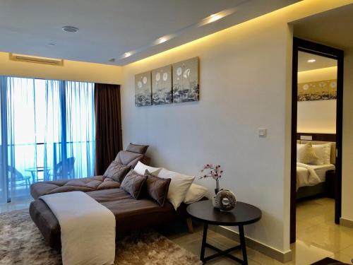 a living room with a couch and a table at Sky D'Mont Suites in Genting Highlands