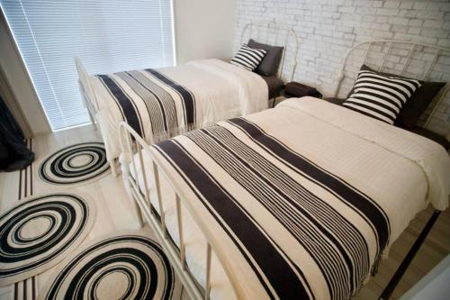 Ein Bett oder Betten in einem Zimmer der Unterkunft Kafuya Tsukisiro 果報家つきしろ