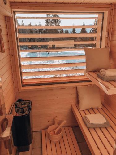 an inside view of a sauna with a window at Holiday House Franc in Srednja Vas v Bohinju