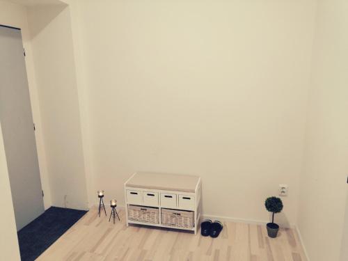 a room with a white wall and a radiator at APARTIA Skořepka, Brno-centrum in Brno