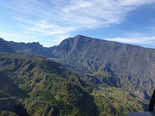 a view of a mountain from an airplane at T2A Lagon Austral "Jardin du lagon" in Saint-Pierre