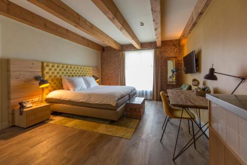 Katil atau katil-katil dalam bilik di Van Rossum Stadshotel Woerden