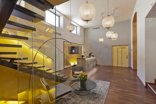 a living room with a yellow accent wall at Swiss Luxury Apartments Geneva in Geneva