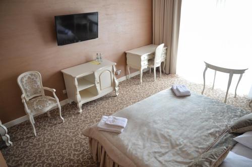 Ένα ή περισσότερα κρεβάτια σε δωμάτιο στο Hotel Kiston