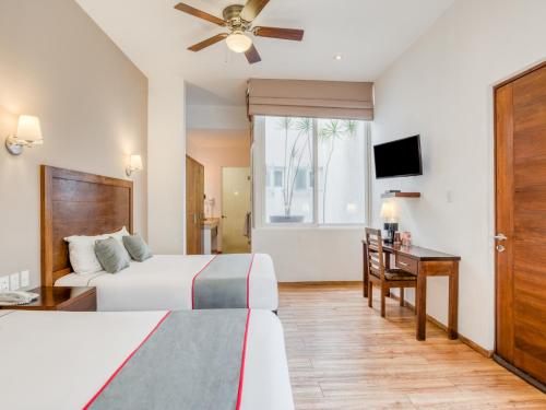 TV i/ili multimedijalni sistem u objektu Hotel Quinta Allende