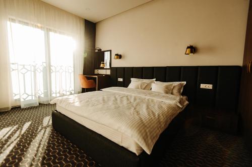 Ένα ή περισσότερα κρεβάτια σε δωμάτιο στο Roa Guesthouse