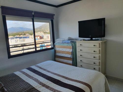 Posteľ alebo postele v izbe v ubytovaní Apartamentos Mediterraneo
