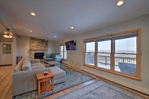 a living room with a couch and a fireplace at Catskills Mtn Retreat with Panoramic View and Fire Pit in Cornwallville