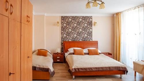 Posteľ alebo postele v izbe v ubytovaní Hotel Livia