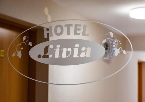 a sign for a hotel la lula in a room at Hotel Livia in Wołomin