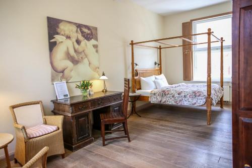 Ein Bett oder Betten in einem Zimmer der Unterkunft Altstadthotel Twardokus