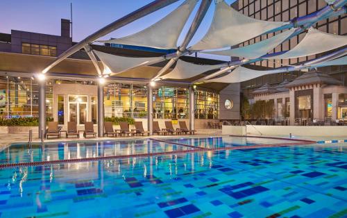 a large swimming pool in a building at Holiday Inn Kuwait Al Thuraya City, an IHG Hotel in Kuwait