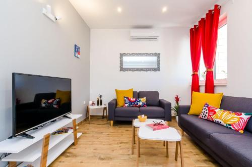 TV a/nebo společenská místnost v ubytování Apartment Moon River
